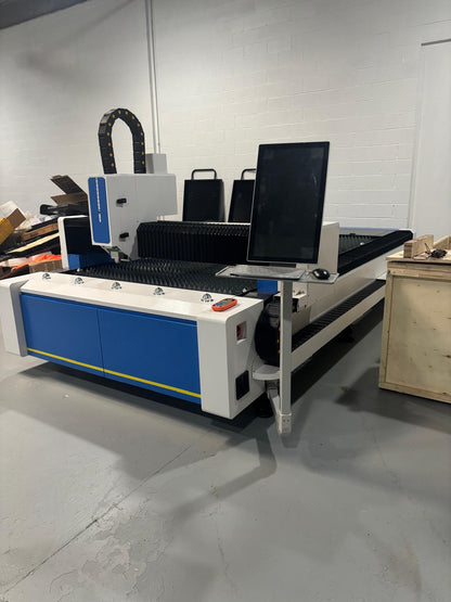 UmproTech machine deposit for 3kw model featuring monitor and cutting surface in workshop environment.