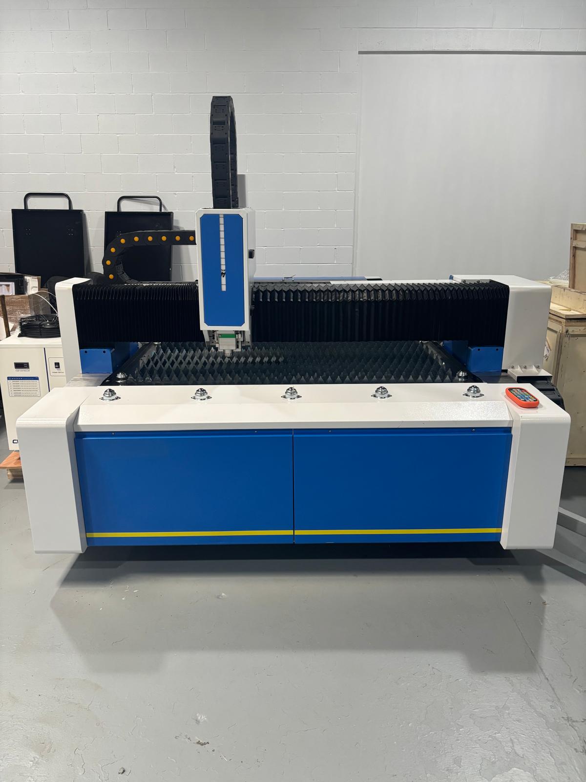 UmproTech machine deposit image showcasing a professional-grade laser cutting machine in a workshop setting.